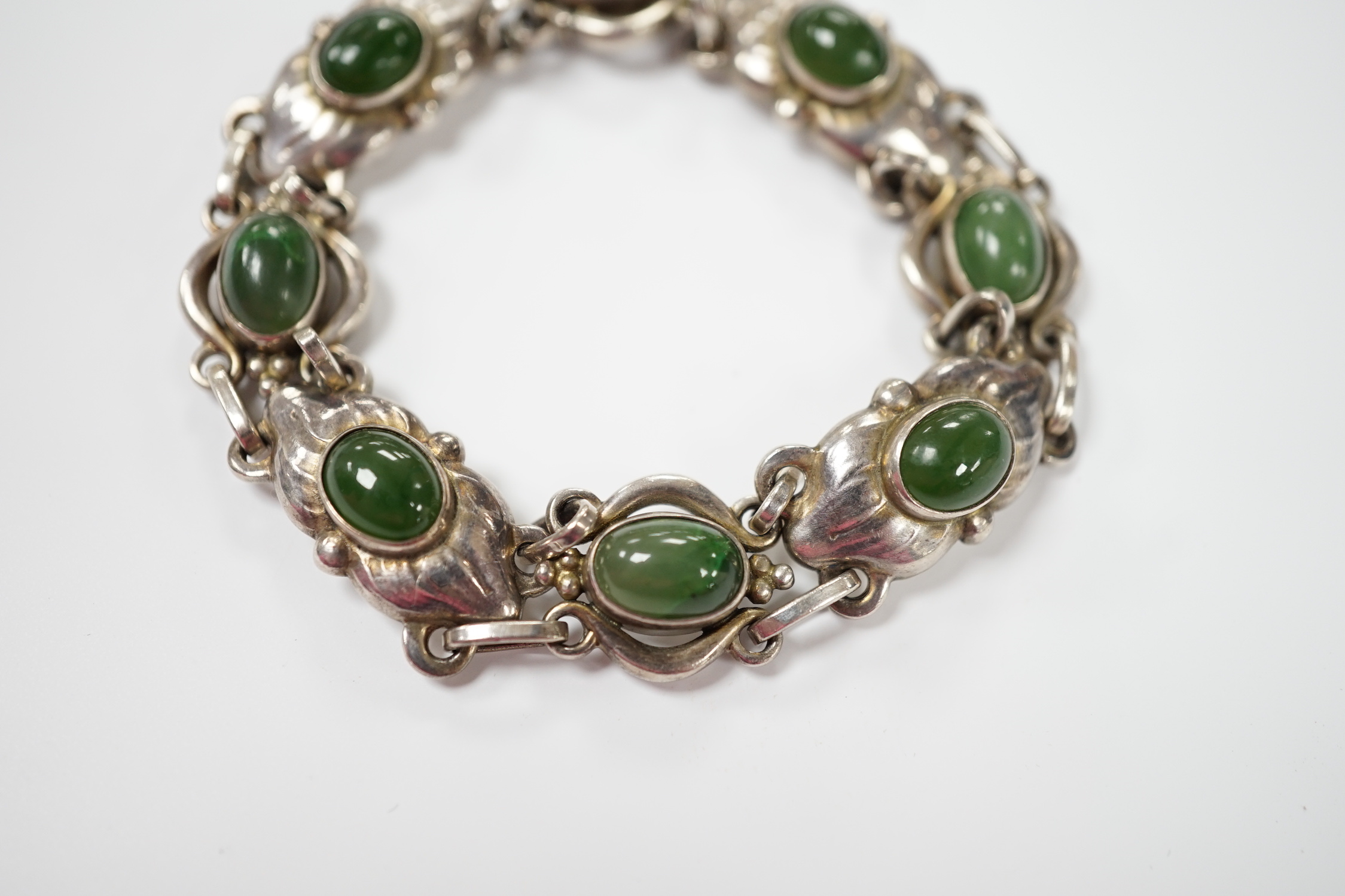 A 1970's Georg Jensen silver and cabochon nephrite set bracelet, design no.16, 18cm.